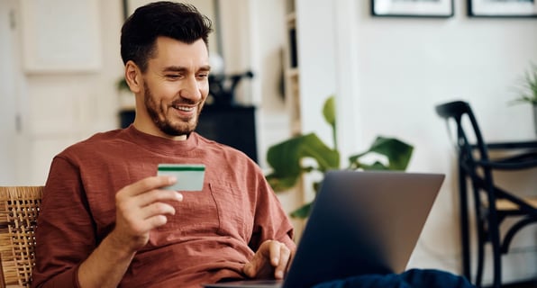 Male tenant uses credit card to make online rent payment