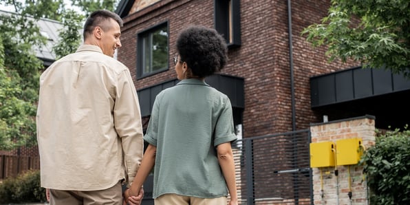 A couple viewing a prospective rental property for sale in Hampton Roads