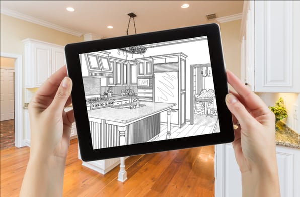 A person holding a tablet mapping out kitchen renovations