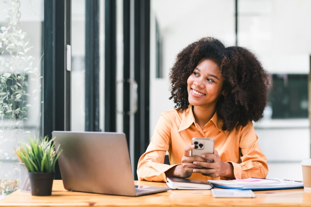 A relaxed woman sitting at her laptop