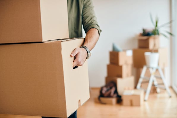 Close-up of a man with moving boxes, move-in procedures concept