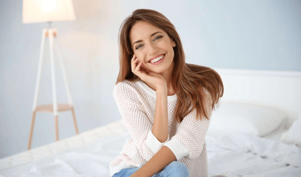 Female tenant is pictured smiling into the camera