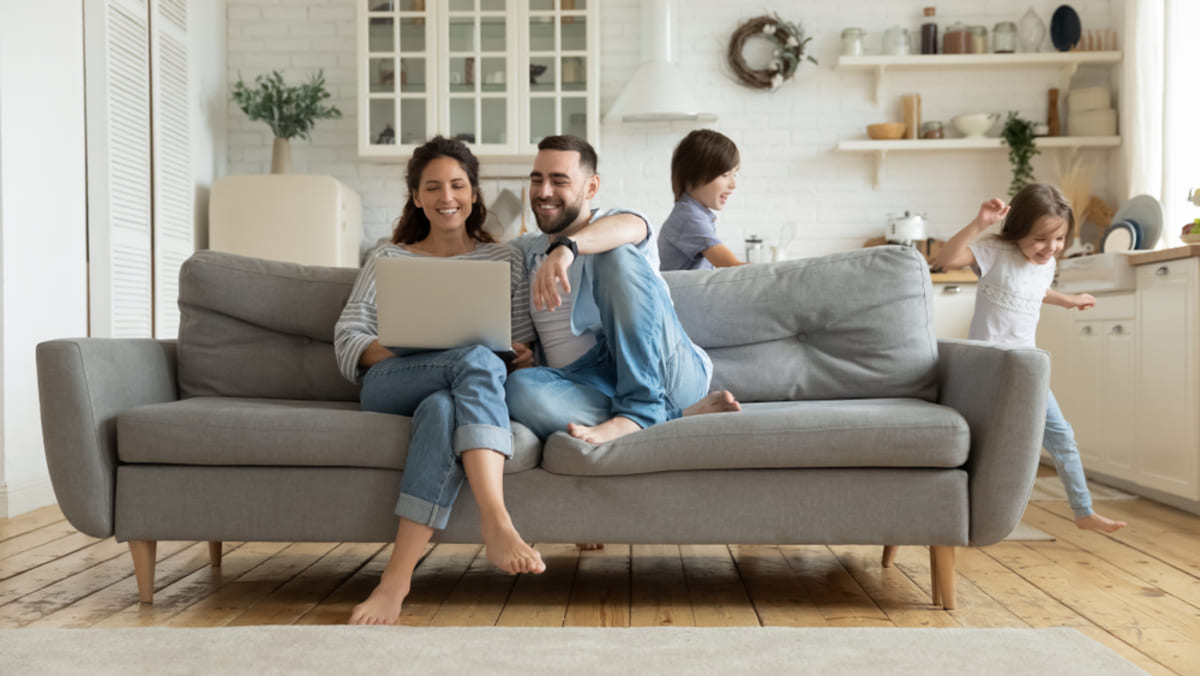 Happy tenants sitting on a couch