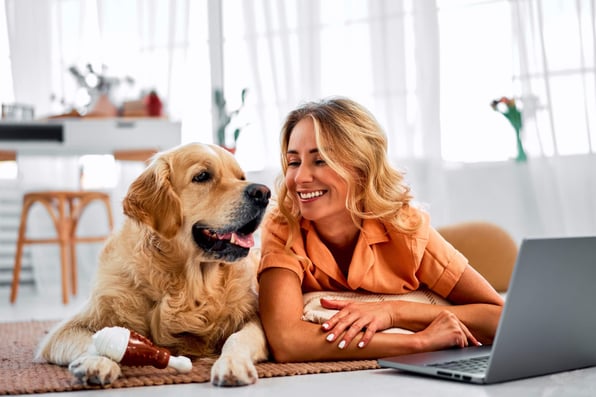 Female tenant with a golden retriever in her rental property