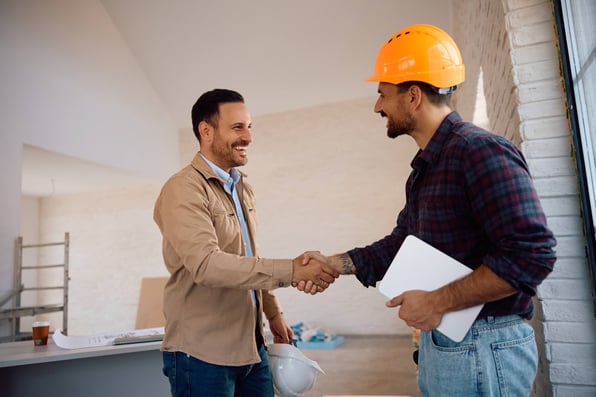 Property owner shakes hands with full service property manager