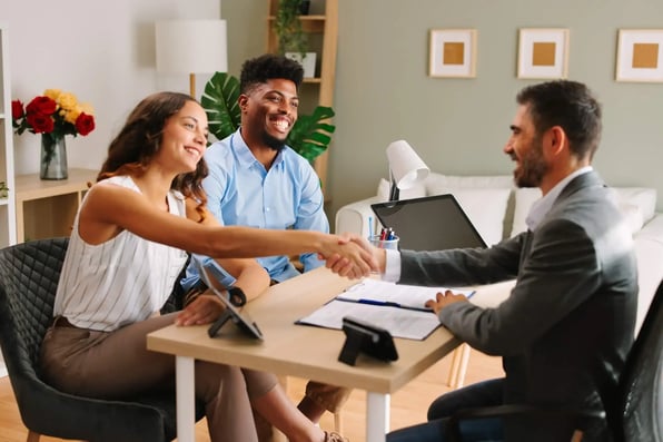 Hampton Roads property manager shaking hands with rental property owners