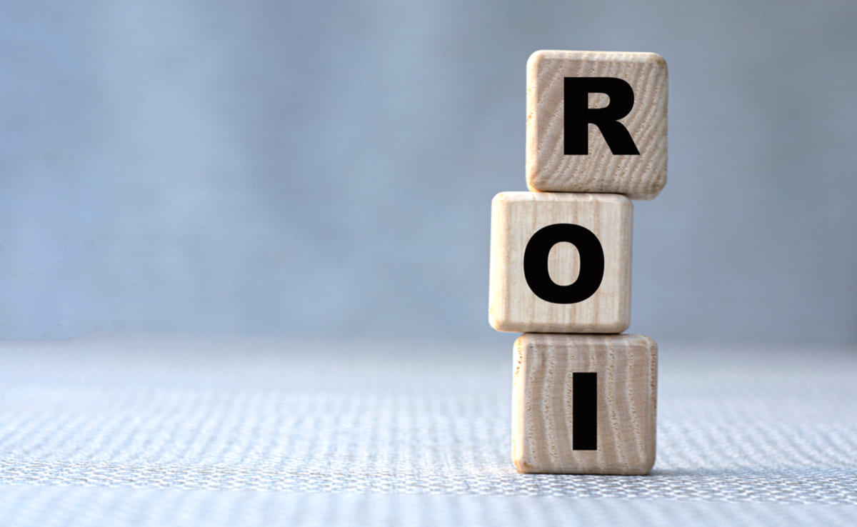 Wooden cubes stacked on top of each other that spell out ROI