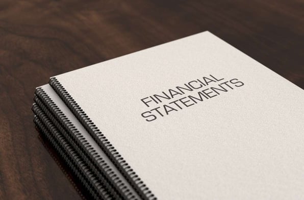 A stack of financial statements, owner statement concept