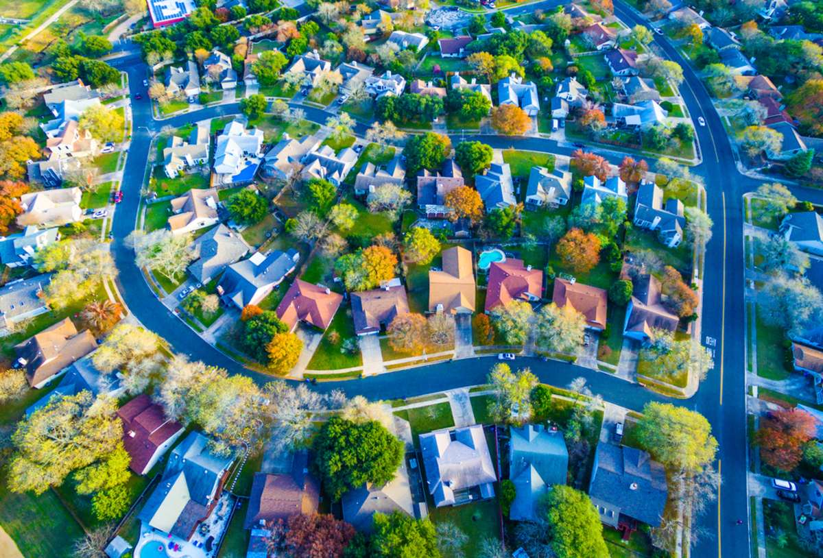 Aerial image of suburban homes showcase the need for experienced portfolio property management