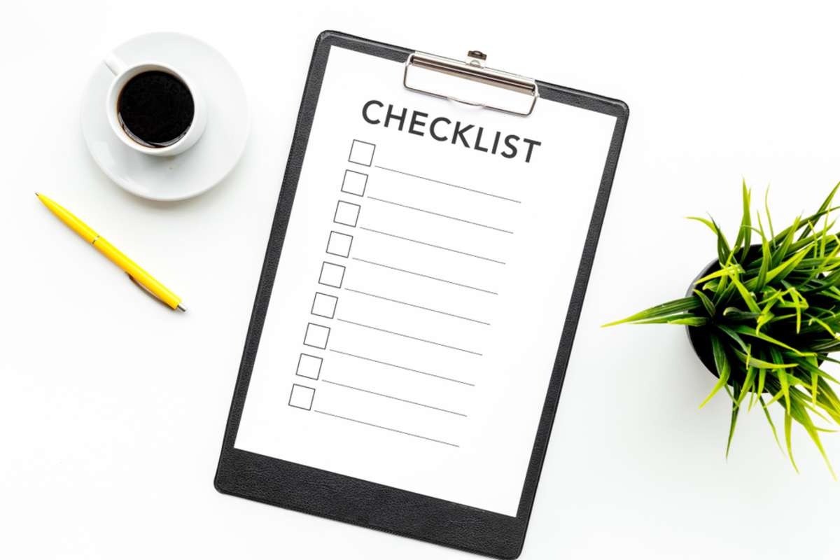 Close-up of pen and checklist, tenant screening criteria concept