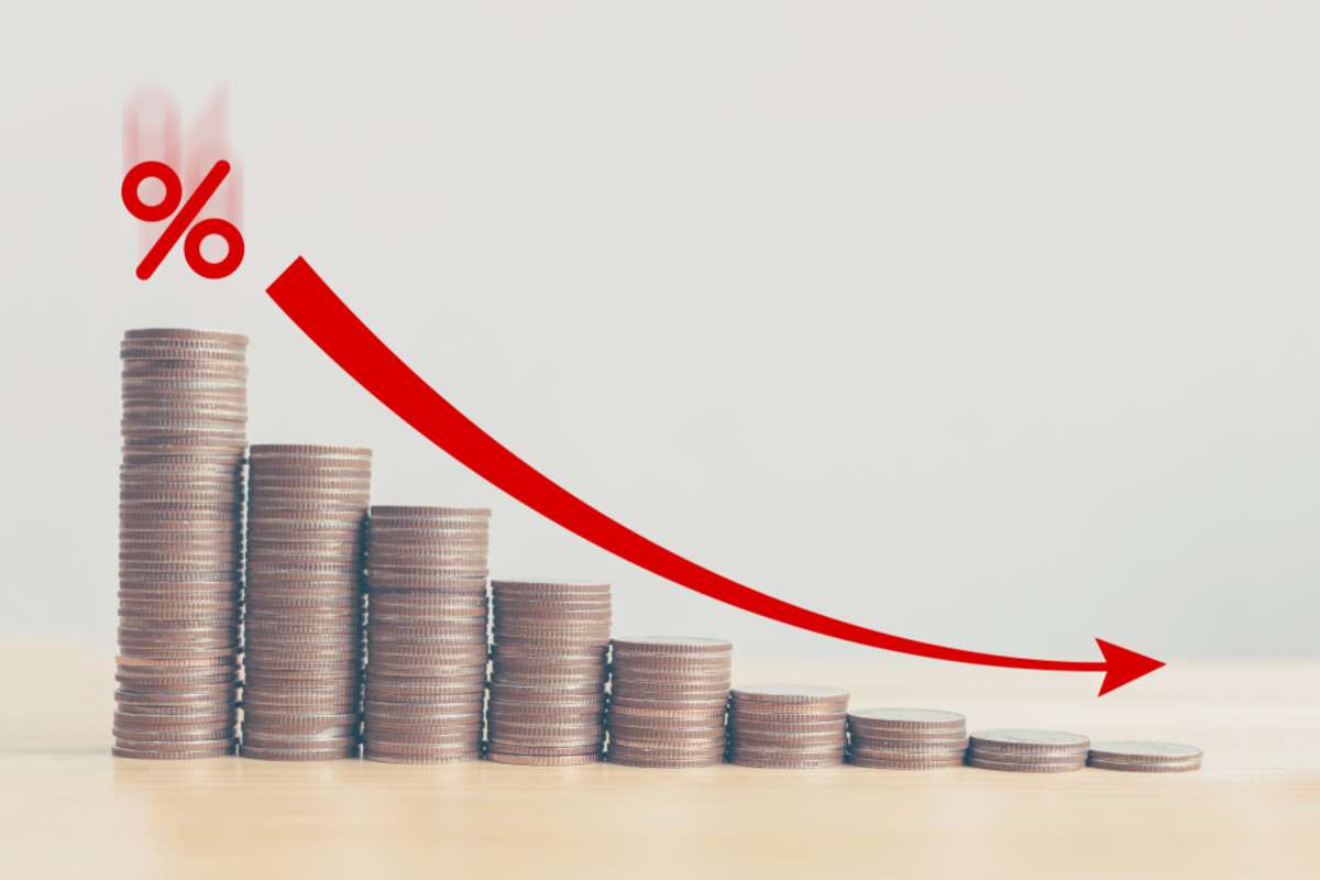 Coin stack down graph with red arrow and percent icon, losing money being a landlord and making mistakes concept. 