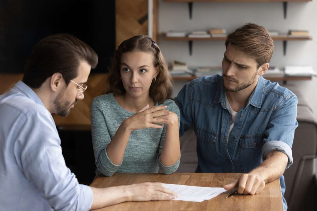 Couple of angry tenants having dispute with real estate agent