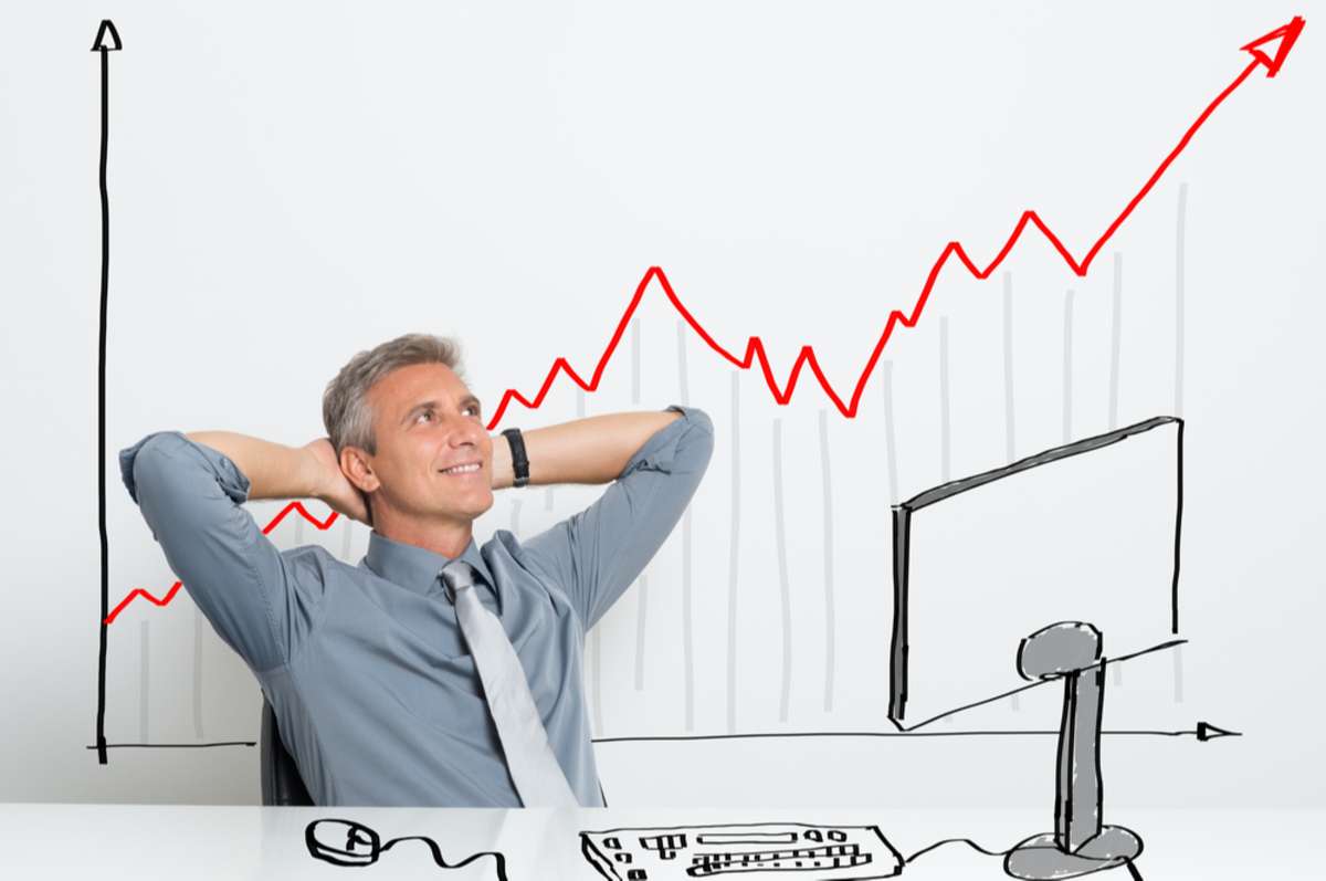 Portrait Of Smiling Successful Businessman With Successful Investment