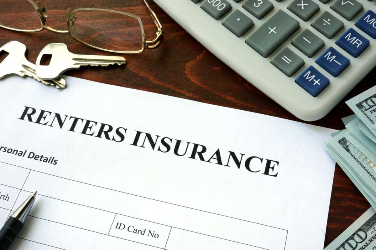 Renters insurance document on a table, good investment property management concept