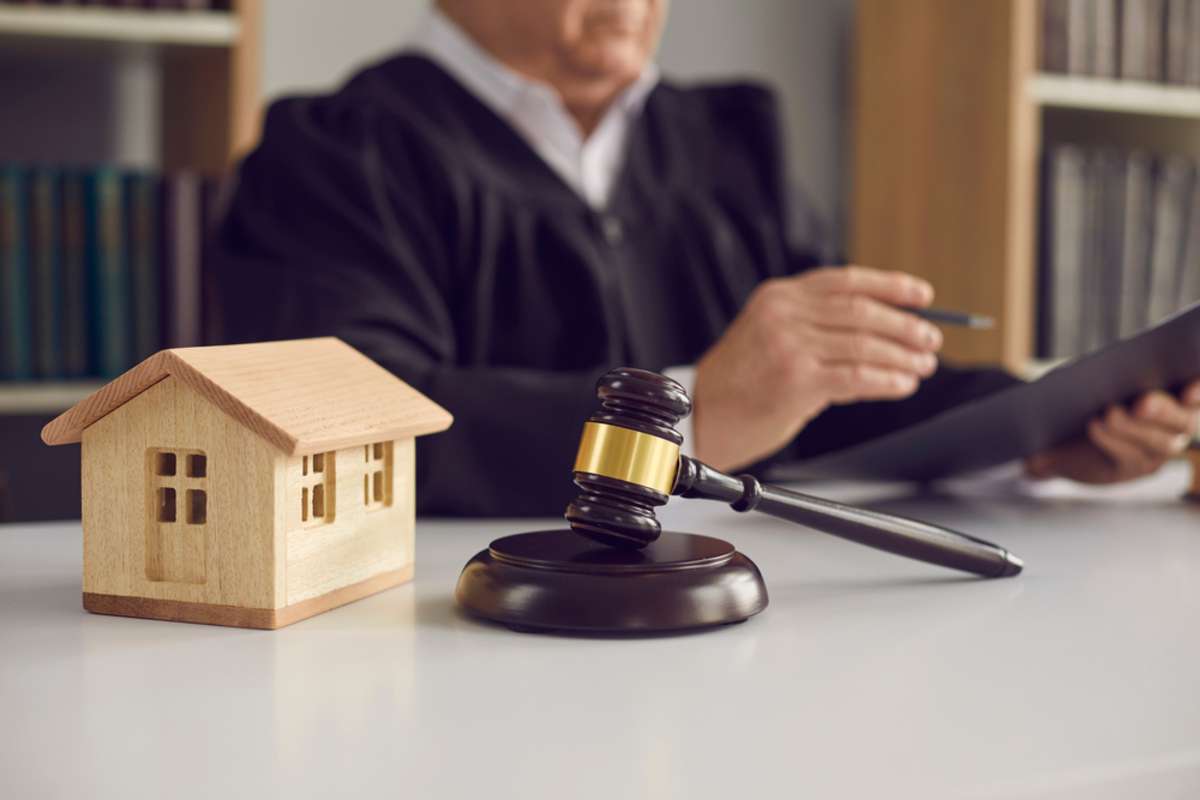 sound block and small wooden toy house on court table