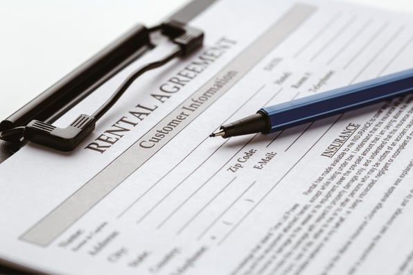 A pen on top of a rental agreement