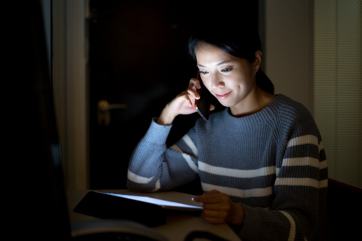 woman-use-of-digital-tablet-and-talk-to-cellphone-2025-03-27-00-47-53-utc
